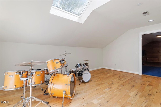 1054 Canterbury Ln, Chapel Hill, NC 27517 - miscellaneous room featuring vaulted ceiling, light wood-type flooring, and a skylight