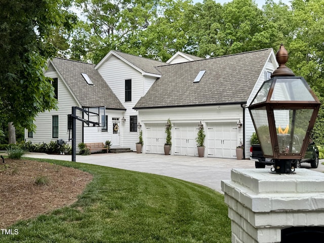 1054 Canterbury Ln, Chapel Hill, NC 27517 - view of front facade with driveway, roof with shingles, an attached garage, and a front lawn