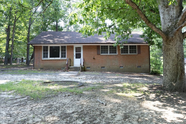 3204 Friar Tuck Rd, Raleigh, NC 27610 - view of front of house with crawl space, entry steps, brick siding, and roof with shingles