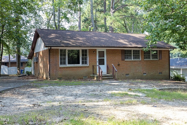 3204 Friar Tuck Rd, Raleigh, NC 27610 - view of front of house with crawl space, brick siding, entry steps, and a shingled roof