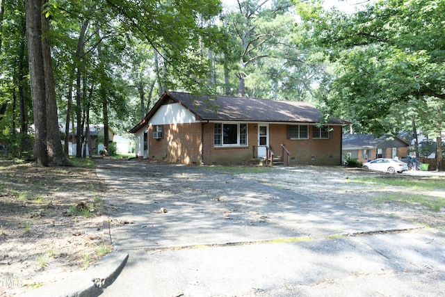 3204 Friar Tuck Rd, Raleigh, NC 27610 - single story home with brick siding, asphalt driveway, and crawl space