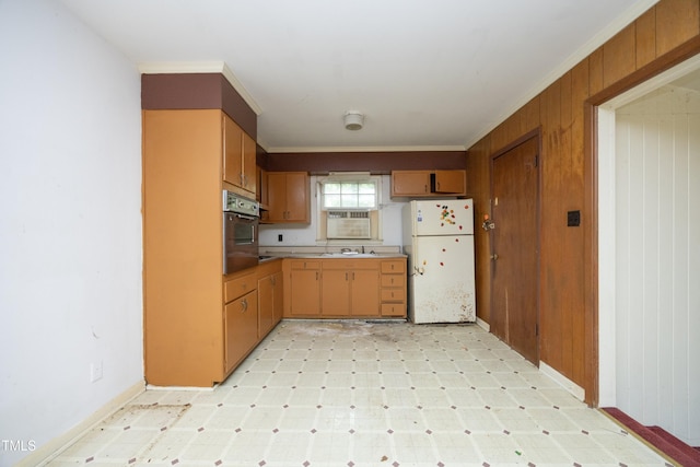 3204 Friar Tuck Rd, Raleigh, NC 27610 - kitchen featuring freestanding refrigerator, stainless steel oven, light flooring, light countertops, and ornamental molding