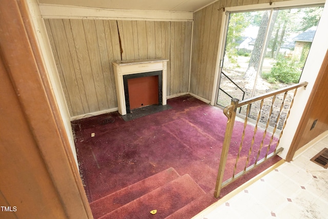 3204 Friar Tuck Rd, Raleigh, NC 27610 - stairway with wooden walls and carpet