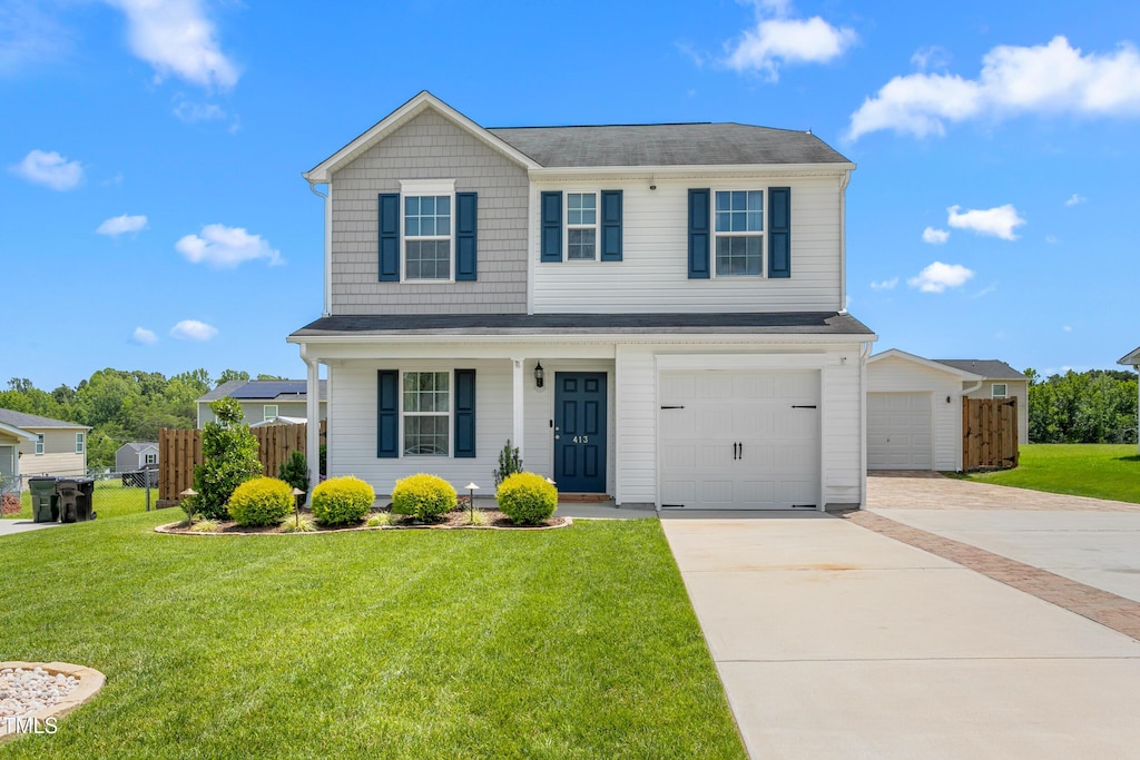 413 Hallie Long Ln, Burlington, NC 27217 - view of front facade with driveway and a garage