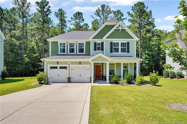 116 School Side Dr, Spring Lake, NC 28390 - craftsman-style home featuring an attached garage, concrete driveway, covered porch, a front yard, and a shingled roof