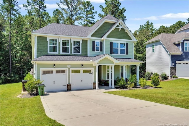 116 School Side Dr, Spring Lake, NC 28390 - craftsman-style home featuring concrete driveway, a garage, a front lawn, and covered porch
