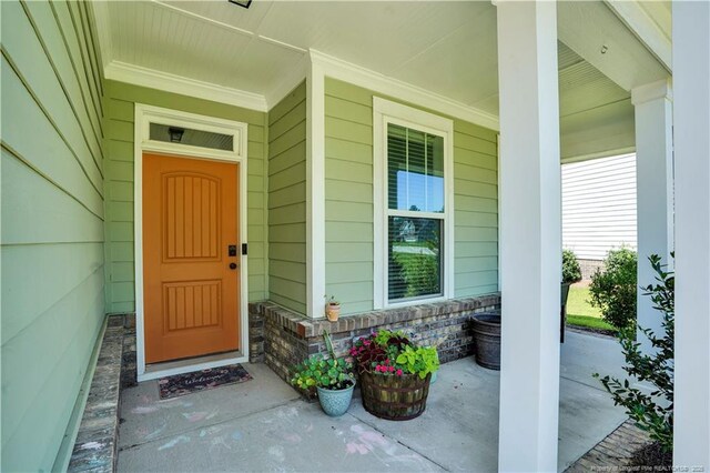 116 School Side Dr, Spring Lake, NC 28390 - doorway to property with a porch