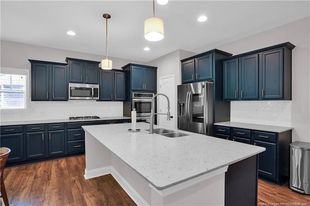 116 School Side Dr, Spring Lake, NC 28390 - kitchen featuring appliances with stainless steel finishes, pendant lighting, backsplash, light stone counters, and recessed lighting