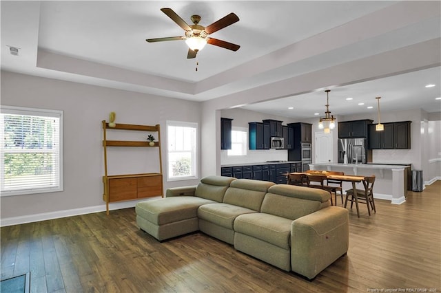 116 School Side Dr, Spring Lake, NC 28390 - living room featuring a ceiling fan, dark wood-style floors, a tray ceiling, and recessed lighting