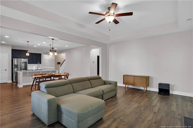116 School Side Dr, Spring Lake, NC 28390 - living area with stairs, a ceiling fan, dark wood-style flooring, recessed lighting, and a raised ceiling