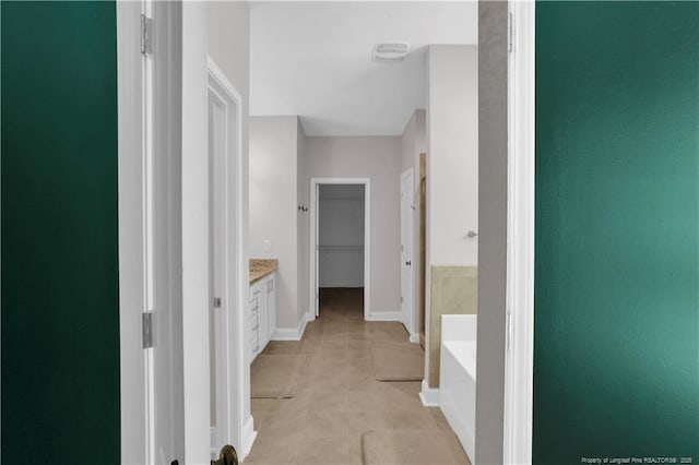 116 School Side Dr, Spring Lake, NC 28390 - corridor featuring baseboards and light tile patterned floors