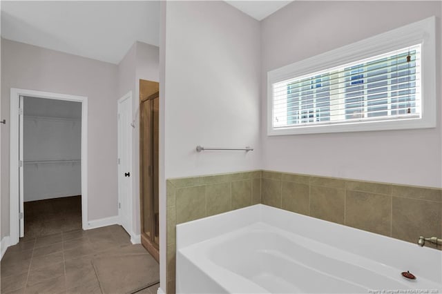 116 School Side Dr, Spring Lake, NC 28390 - full bath with a garden tub, a shower stall, a spacious closet, and tile patterned floors