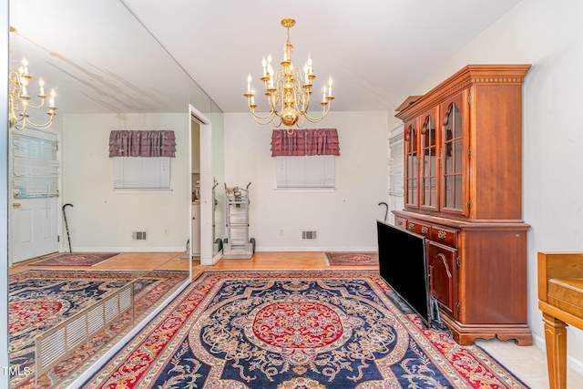 612 Locust Ln, Raleigh, NC 27603 - dining space with a chandelier and baseboards