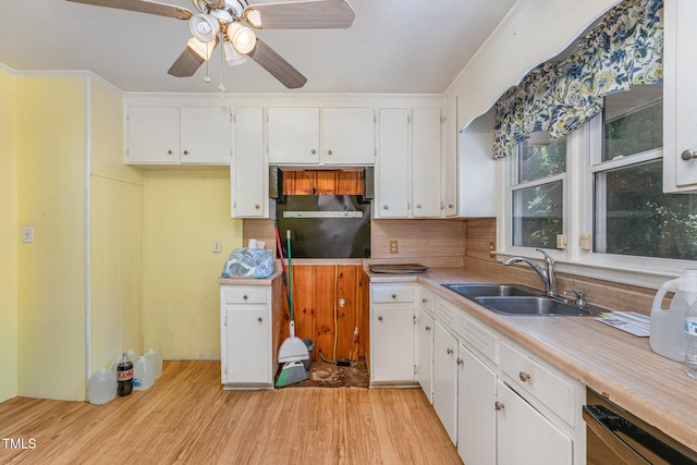 612 Locust Ln, Raleigh, NC 27603 - kitchen with light wood-style flooring, white cabinetry, backsplash, ceiling fan, and light countertops