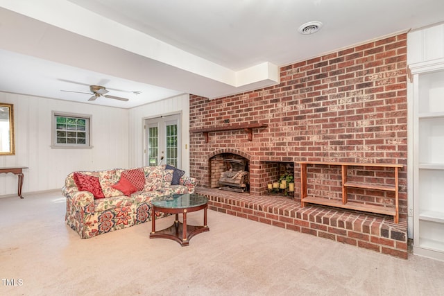 612 Locust Ln, Raleigh, NC 27603 - carpeted living room featuring a fireplace and a ceiling fan
