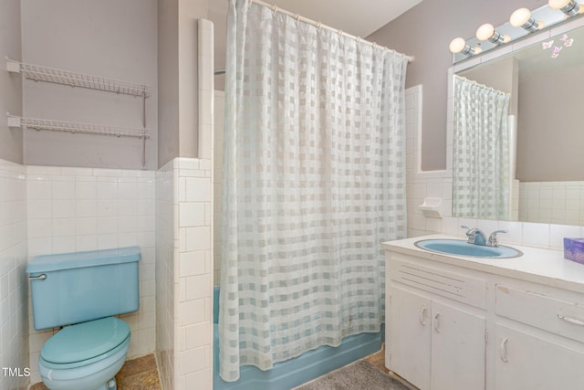 612 Locust Ln, Raleigh, NC 27603 - full bathroom featuring tile walls, vanity, shower / tub combo, and a wainscoted wall