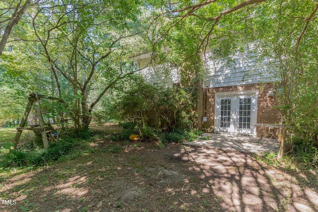 612 Locust Ln, Raleigh, NC 27603 - view of yard featuring french doors