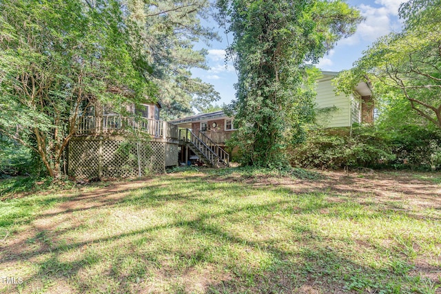 612 Locust Ln, Raleigh, NC 27603 - view of grassy yard featuring stairway and a wooden deck