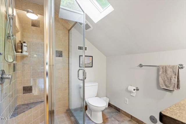 701 Bennington Dr, Raleigh, NC 27615 - full bathroom featuring vaulted ceiling, a skylight, a shower stall, and tile patterned flooring
