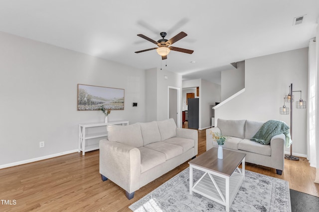 3119 Guiding Light Rd, Raleigh, NC 27610 - living area with ceiling fan and light wood-style floors