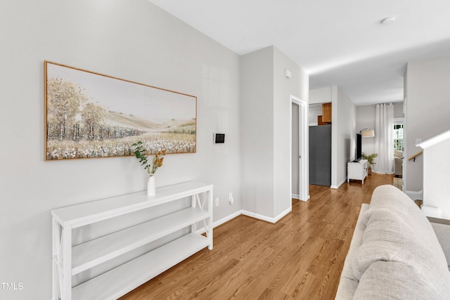 3119 Guiding Light Rd, Raleigh, NC 27610 - hallway featuring wood finished floors and baseboards