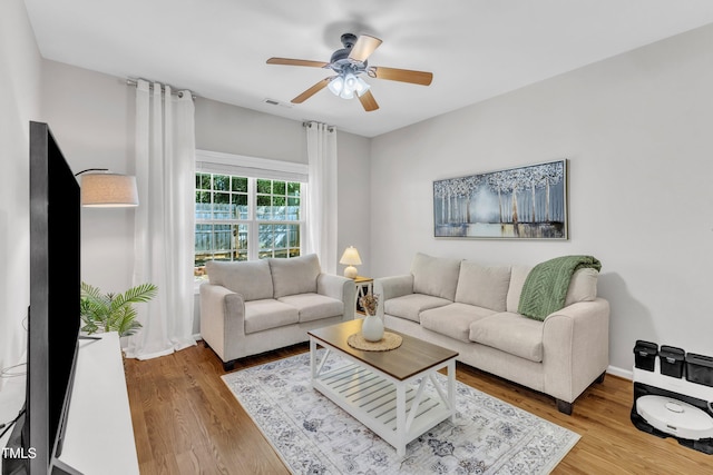 3119 Guiding Light Rd, Raleigh, NC 27610 - living area with a ceiling fan and wood finished floors