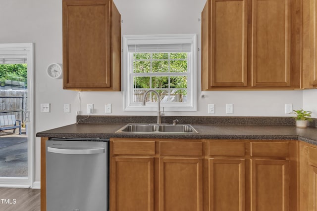 3119 Guiding Light Rd, Raleigh, NC 27610 - kitchen featuring stainless steel dishwasher, dark countertops, and healthy amount of natural light