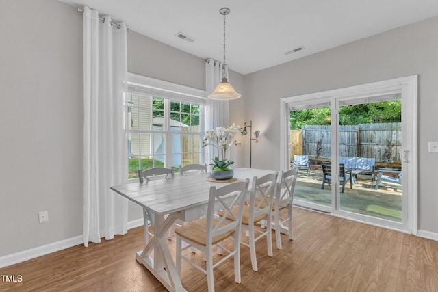 3119 Guiding Light Rd, Raleigh, NC 27610 - dining space with light wood-style floors and baseboards