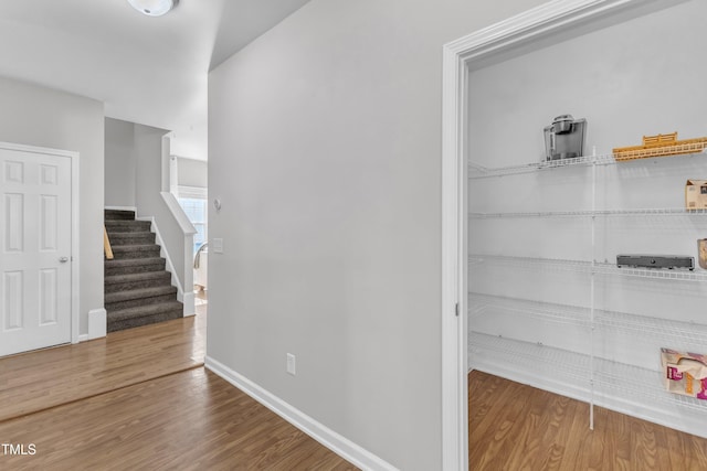 3119 Guiding Light Rd, Raleigh, NC 27610 - hallway with wood finished floors and stairs