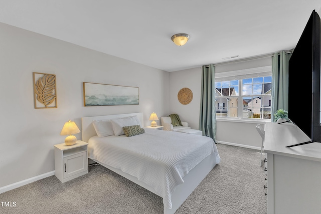 3119 Guiding Light Rd, Raleigh, NC 27610 - bedroom with light carpet and baseboards
