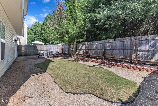 3119 Guiding Light Rd, Raleigh, NC 27610 - fenced backyard featuring a patio area