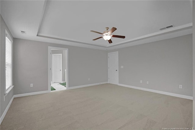 786 Century Dr, Cameron, NC 28326 - carpeted spare room featuring a raised ceiling, ceiling fan, and healthy amount of natural light