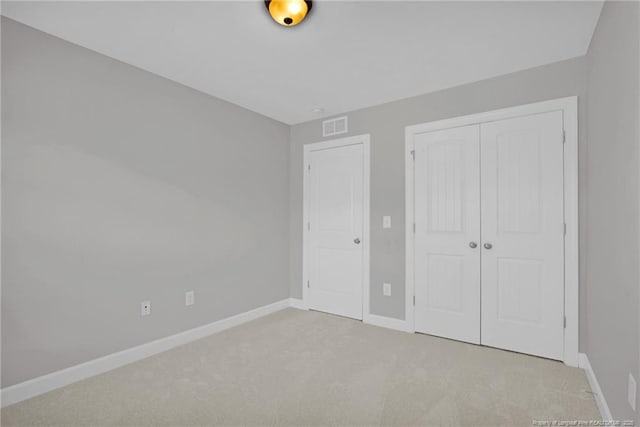 786 Century Dr, Cameron, NC 28326 - unfurnished bedroom featuring light colored carpet and a closet