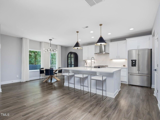 128 Chapel Run Way, Chapel Hill, NC 27517 - kitchen featuring high end fridge, a center island with sink, light countertops, white cabinets, and recessed lighting