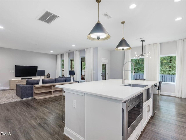 128 Chapel Run Way, Chapel Hill, NC 27517 - kitchen featuring stainless steel appliances, light countertops, an island with sink, pendant lighting, and recessed lighting