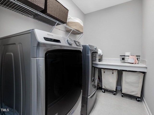 128 Chapel Run Way, Chapel Hill, NC 27517 - laundry room featuring washer and dryer and light tile patterned floors