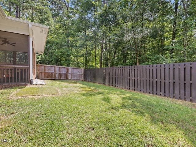 128 Chapel Run Way, Chapel Hill, NC 27517 - fenced backyard with a ceiling fan and a sunroom