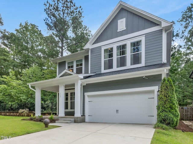 128 Chapel Run Way, Chapel Hill, NC 27517 - view of front facade with a garage, board and batten siding, driveway, and a front lawn