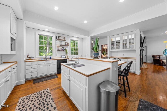 2602 Vintage Hill Ct, Durham, NC 27712 - kitchen with black dishwasher, a center island with sink, white cabinets, recessed lighting, and dark wood-type flooring