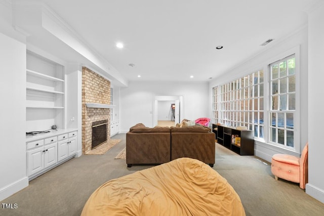 2602 Vintage Hill Ct, Durham, NC 27712 - living room with carpet flooring, a brick fireplace, built in shelves, recessed lighting, and ornamental molding