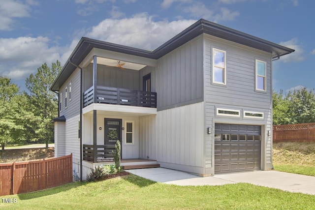 931 Ramseur St, Durham, NC 27701 - contemporary house with a balcony, an attached garage, concrete driveway, and board and batten siding