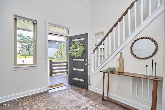 931 Ramseur St, Durham, NC 27701 - entrance foyer featuring wood finished floors and stairway