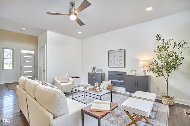 931 Ramseur St, Durham, NC 27701 - living room featuring ceiling fan, dark wood-style floors, recessed lighting, and a glass covered fireplace