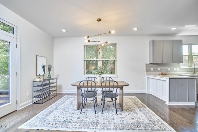 931 Ramseur St, Durham, NC 27701 - dining room featuring a chandelier, dark wood-style flooring, and recessed lighting