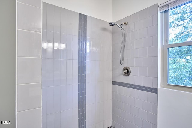 931 Ramseur St, Durham, NC 27701 - bathroom featuring a tile shower and plenty of natural light