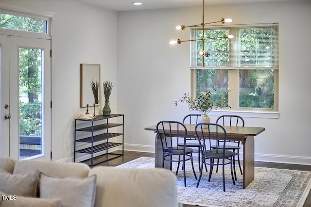 931 Ramseur St, Durham, NC 27701 - dining space with dark wood-type flooring and a chandelier
