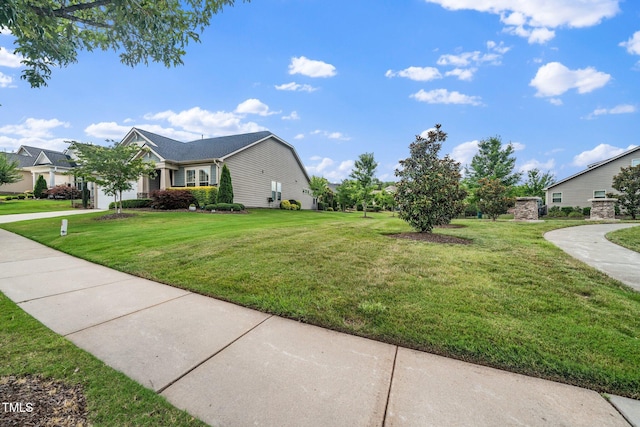 1409 Pulitzer Ln, Durham, NC 27703 - view of side of home with a lawn and a garage