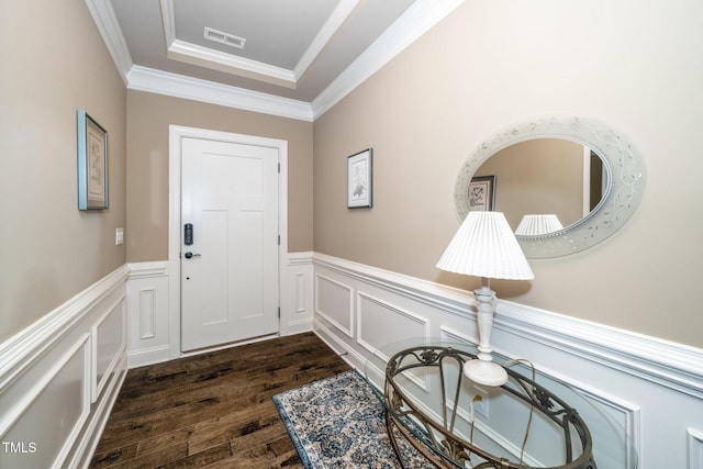 1409 Pulitzer Ln, Durham, NC 27703 - foyer entrance with dark wood-style flooring, a wainscoted wall, crown molding, and a decorative wall