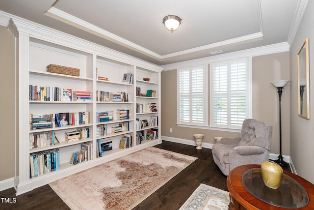 1409 Pulitzer Ln, Durham, NC 27703 - living area featuring a tray ceiling, dark wood-type flooring, and crown molding
