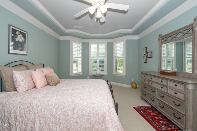 1409 Pulitzer Ln, Durham, NC 27703 - carpeted bedroom with ornamental molding, a tray ceiling, and ceiling fan